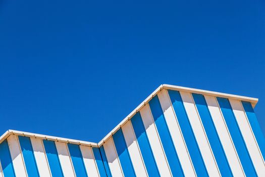 detail of cabin on a beach with blue sky on background