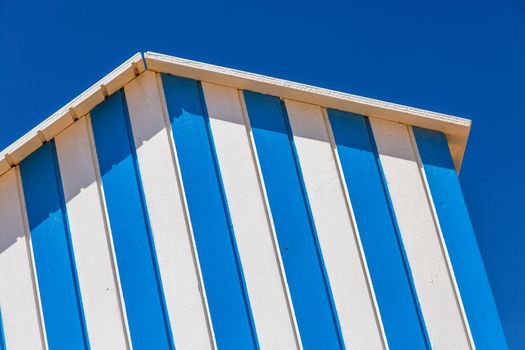 detail of cabin on a beach with blue sky on background