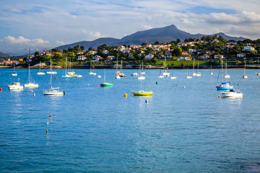 Saint jean de Luz bay with luxurious boats on a sea