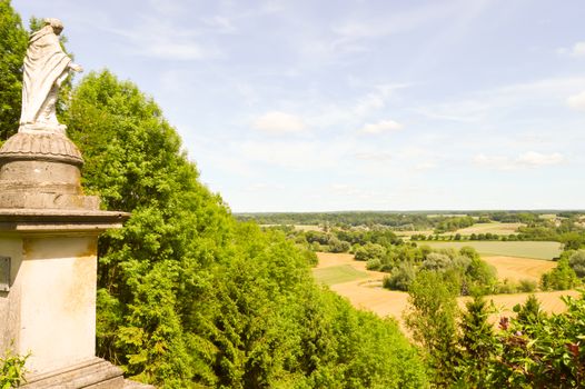 Statue of the Virgin Mary overlooking a valley in the department of the Meuse in France