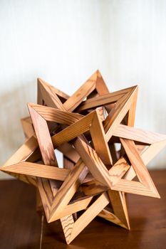 wooden abstraction of triangles on a white background
