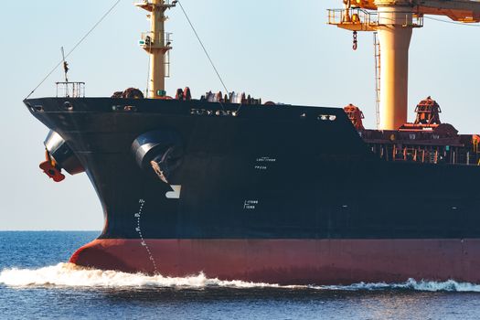 Black cargo ship sailing from the Baltic sea