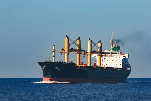 Black cargo ship sailing from the Baltic sea