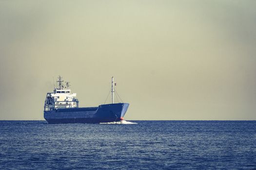 Blue cargo ship sailing from the Baltic sea