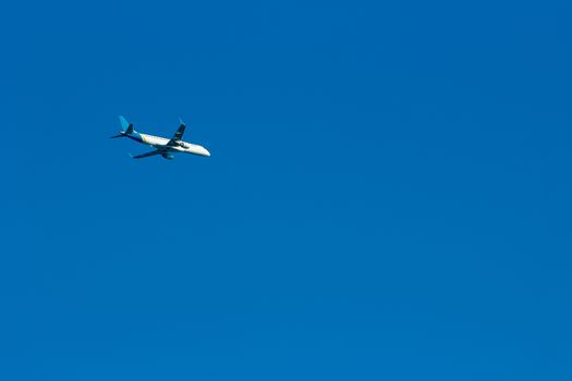 Passenger aircraft flying in the blue sky