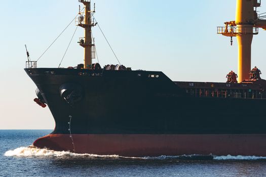 Black cargo ship sailing from the Baltic sea