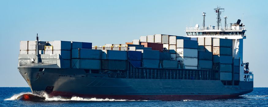 Large grey container ship moving from Baltic sea