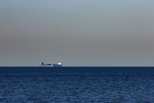 Blue cargo ship sailing from the Baltic sea