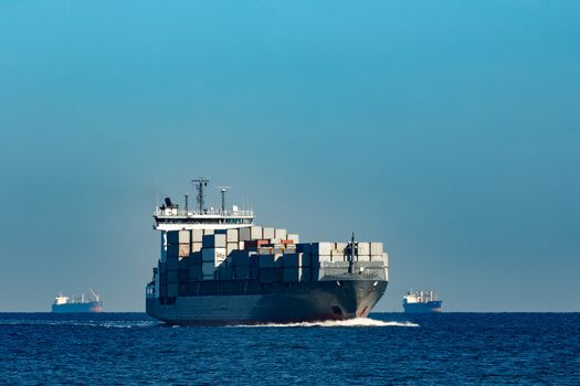 Large grey container ship moving from Baltic sea