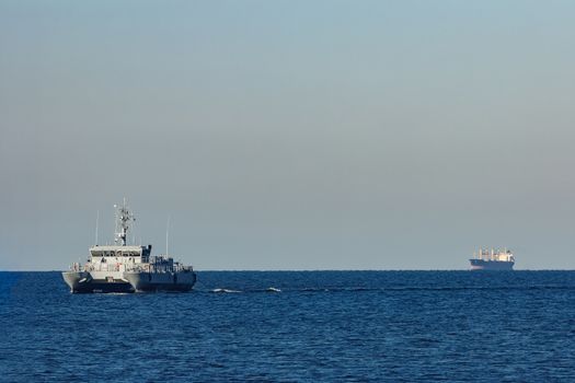 Small grey military ship moving from Baltic sea