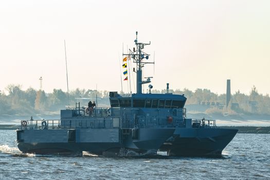 Small grey military ship moving from Baltic sea