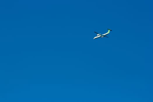 Passenger aircraft flying in the blue sky