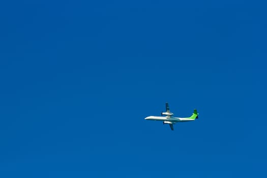Passenger aircraft flying in the blue sky