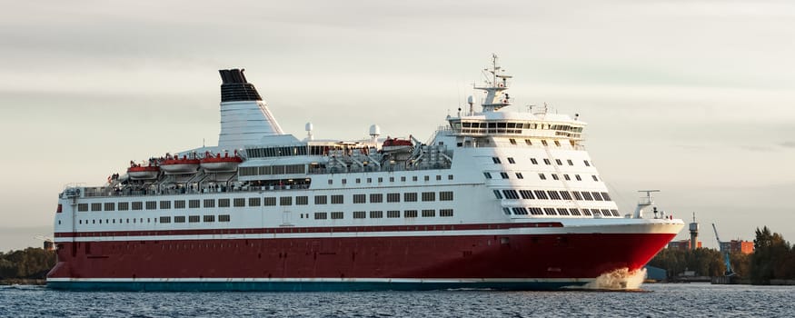 Red cruise liner. Passenger ferry sailing from Riga to Stockholm