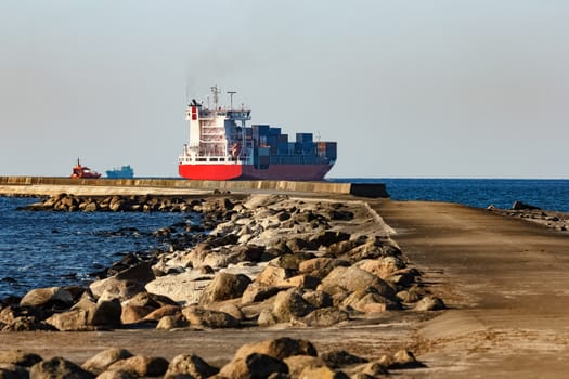 Red container ship sailing to the Baltic sea