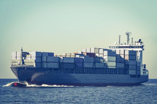 Large grey container ship moving from Baltic sea