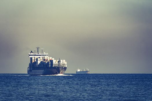 Large grey container ship moving from Baltic sea