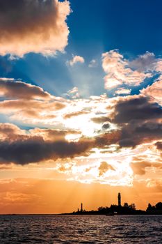 Golden sunset sky over the town silhouette