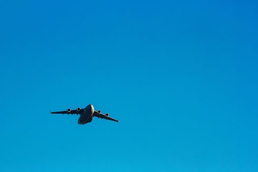 Passenger aircraft flying in the blue sky