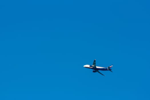 Passenger aircraft flying in the blue sky