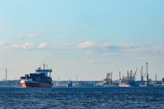 Red container ship sailing to the Baltic sea
