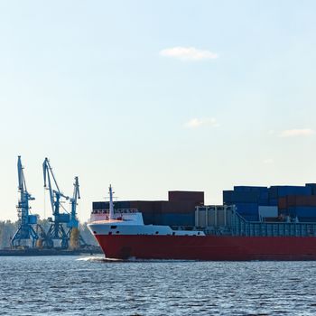 Red container ship sailing to the Baltic sea