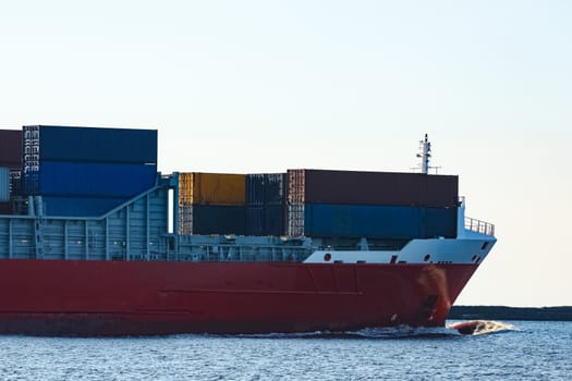 Red container ship sailing to the Baltic sea