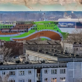 Green cruise liner. Passenger ferry sailing past the Riga city