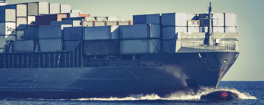 Large grey container ship moving from Baltic sea