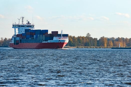 Red container ship sailing to the Baltic sea