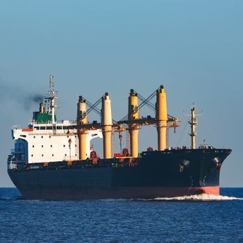 Black cargo ship sailing from the Baltic sea