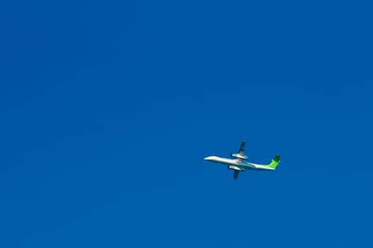 Passenger aircraft flying in the blue sky