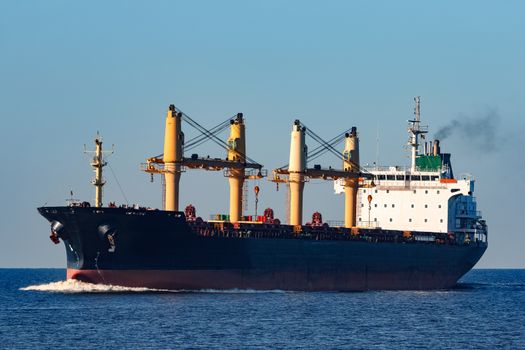 Black cargo ship sailing from the Baltic sea