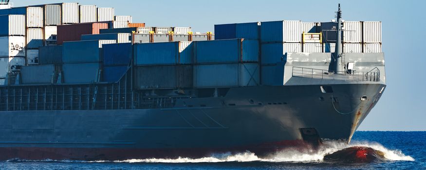 Large grey container ship moving from Baltic sea