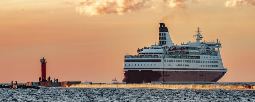 Red cruise liner. Passenger ferry sailing from Riga to Stockholm