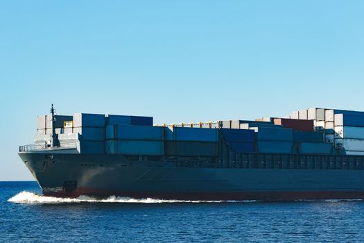 Large grey container ship moving from Baltic sea