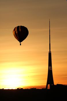 Air balloon over TV tower at sunset in summer time in Riga, Latvia