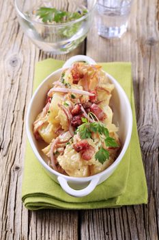 Dish of potatoes, ham, bacon and cream