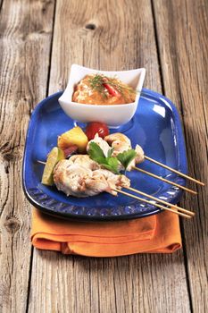 Chicken skewers and vegetable dipping sauce