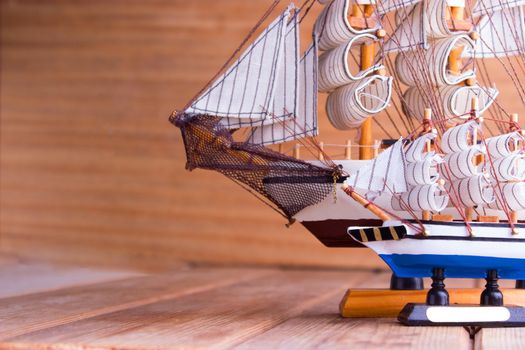 model of ships on the wooden table. travel concept