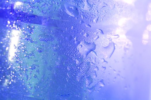 water drops on plastic bottle background close up