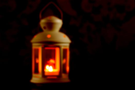 white lantern with a candle background. blured. unfocused