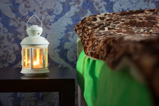 beautiful lantern near the bed. romantic concept