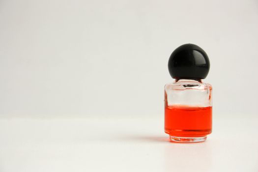 Waste of resources concept. Perfume in the bottle. on a white background. Photo for your design