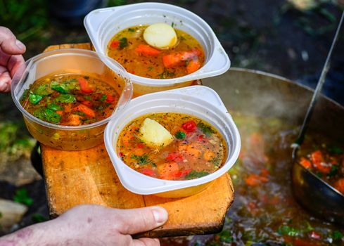 Hot soup in a tourist bowler on a picnic.