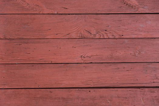 Background of horizontal wooden boards, painted with red color