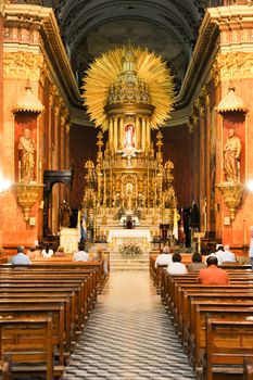 Salta, Argentina - 22 January 2011: People in prayer at the cathedral of Salta on northen Argentina