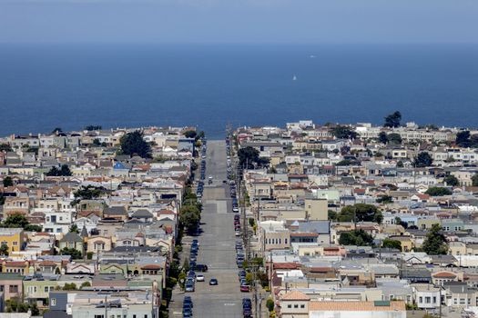 This is a mountain view image of Moraga Street, in San Francisco, California. Image is looking West towards the Pacific ocean.