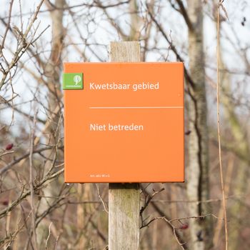 Lauwersoog; tourist sign saying 'no entry (niet betreden)'. Nature park