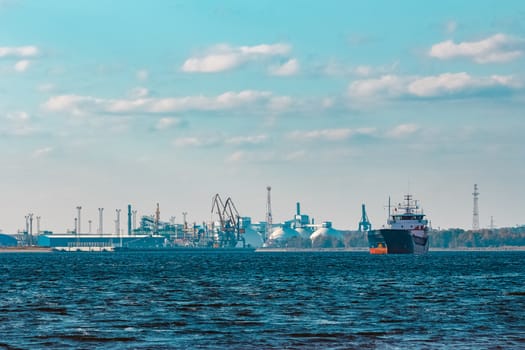 Blue cargo ship moving to the cargo port